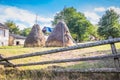 Haystacks in a small village. Mountain from view with small village sunny day.Sunny summer morning in the mountains and a small Royalty Free Stock Photo