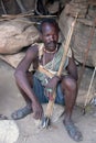 Hazabe bushman of the hadza tribe preparing arrows for hunting Royalty Free Stock Photo