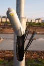 hazardous area, metal pole, electrical wires are torn off, a danger sign on a pillar, Royalty Free Stock Photo