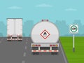 Hazardous materials route road sign area. Back view of tank truck and semi-trailer on highway. Royalty Free Stock Photo