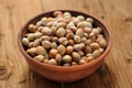Hazel nuts in clay bowl Royalty Free Stock Photo