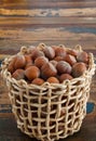 Hazel nuts in wicker busket on table