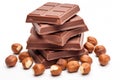 Hazelnut Chocolate Isolated, Stack of Pieces of Milk Chocolate with Whole Hazelnuts on White Royalty Free Stock Photo