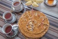 Hazelnut milk cake . Delicious cakes with hazelnut on wooden glass table . Black tea in glass cup on the table . Azerbaijan tea in Royalty Free Stock Photo