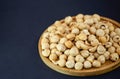 Hazelnut nut or noisettes nuts group Protein and healthy food for diet in a wooden plate