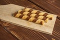 Hazelnut rolled wafer biscuit on brown wood