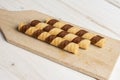 Hazelnut rolled wafer biscuit on grey wood