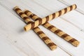 Hazelnut rolled wafer biscuit on grey wood Royalty Free Stock Photo