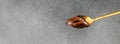 Hazelnut spread with nuts and chocolate on a spoon, Long banner format. top view Royalty Free Stock Photo