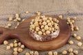 Hazelnut varieties in copper bowl on linen background. Roasted shelled hazelnuts, shelled hazelnuts and shellless roasted