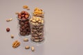 Hazelnut, walnut and pistachio nut. mixed assorted nuts in glass box on light background.