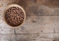 Hazelnuts basket on a wooden rustic table background