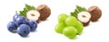 Hazelnuts, blue and green grapes set isolated on white background. Nuts and berries mix Royalty Free Stock Photo