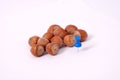 Hazelnuts with blue pushpin Royalty Free Stock Photo