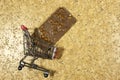 Hazelnuts chocolate bar in shopping cart on grunge background