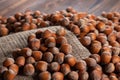 Hazelnuts, filbert on old wooden table. heap or stack of hazel nuts. Hazelnut background, healty food