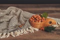 Hazelnuts with green leaves in wooden bowl Royalty Free Stock Photo