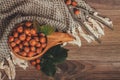 Hazelnuts with green leaves in wooden bowl, top view Royalty Free Stock Photo