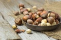 Hazelnuts and hazelnut leaves on the wooden table. Royalty Free Stock Photo