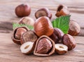 Hazelnuts and hazelnut leaves on the wooden table. Royalty Free Stock Photo