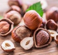 Hazelnuts and hazelnut leaves on the wooden table. Royalty Free Stock Photo