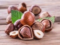 Hazelnuts and hazelnut leaves on the wooden table.