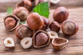 Hazelnuts and hazelnut leaves on the wooden table.