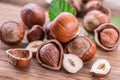 Hazelnuts and hazelnut leaves on the wooden table. Royalty Free Stock Photo