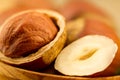 Hazelnuts with leaves on old wooden background. Royalty Free Stock Photo