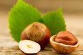 hazelnuts with leaves on old wooden background. Royalty Free Stock Photo