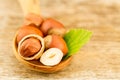 hazelnuts with leaves on old wooden background. Royalty Free Stock Photo