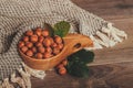 Hazelnuts with  leaves in wooden bowl Royalty Free Stock Photo