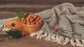 Hazelnuts with leaves in wooden bowl on rustic brown background Royalty Free Stock Photo