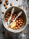 The hazelnuts in an old bucket with a Nutcracker. Royalty Free Stock Photo