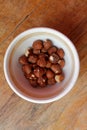 Hazelnuts in a partly emptied bowl