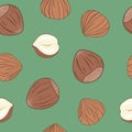 Hazelnuts seamless pattern with green background. Hand drawn vector.