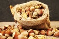 hazelnuts spilled on the table from a canvas bag close-up