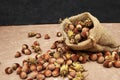 hazelnuts spilled on the table from a canvas bag close-up