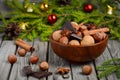 Hazelnuts and walnuts with chocolate and cinnamon in a wooden bowl Royalty Free Stock Photo