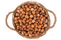Hazelnuts in a wicker basket isolated on white background. Royalty Free Stock Photo