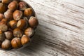 Hazelnuts in wooden bowl on rustic background Royalty Free Stock Photo