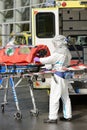 HAZMAT pandemic medical team member with stretcher Royalty Free Stock Photo