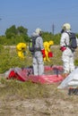 Hazmat team members have been wearing protective suits to protect them from hazardous materials