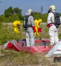 Hazmat team members have been wearing protective suits to protect them from hazardous materials Hazmat team members have been wea