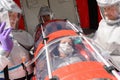 HAZMAT team with patient on stretcher