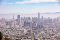 Hazy afternoon view of the San Fransisco skyline looking down Market Street towards the Ferry Building from Twin Peaks.