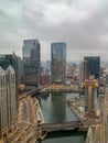 Hazy, cloudy afternoon view of Chicago River and Wacker Drive with neighboring construction