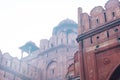 Hazy, foggy, polluted view of Red Fort Lal Qila Delhi India, a  World Heritage Site made of red sandstone, built during the Royalty Free Stock Photo