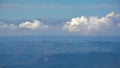 Hazy mountains with windmills, view from Sant Jeroni Royalty Free Stock Photo