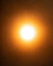 A hazy orange sun due to wildfire smoke in the atmosphere